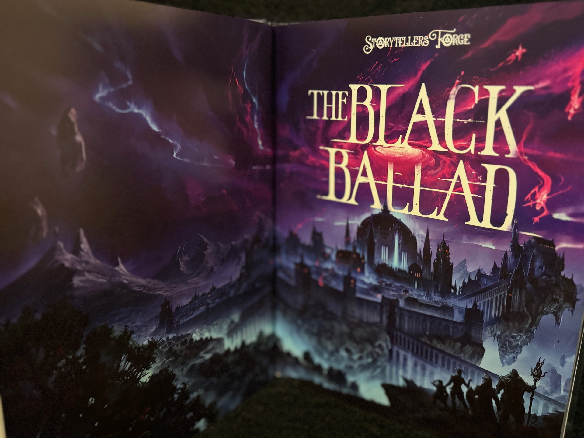 Open book showing a vivid full color spread printed on gloss paper