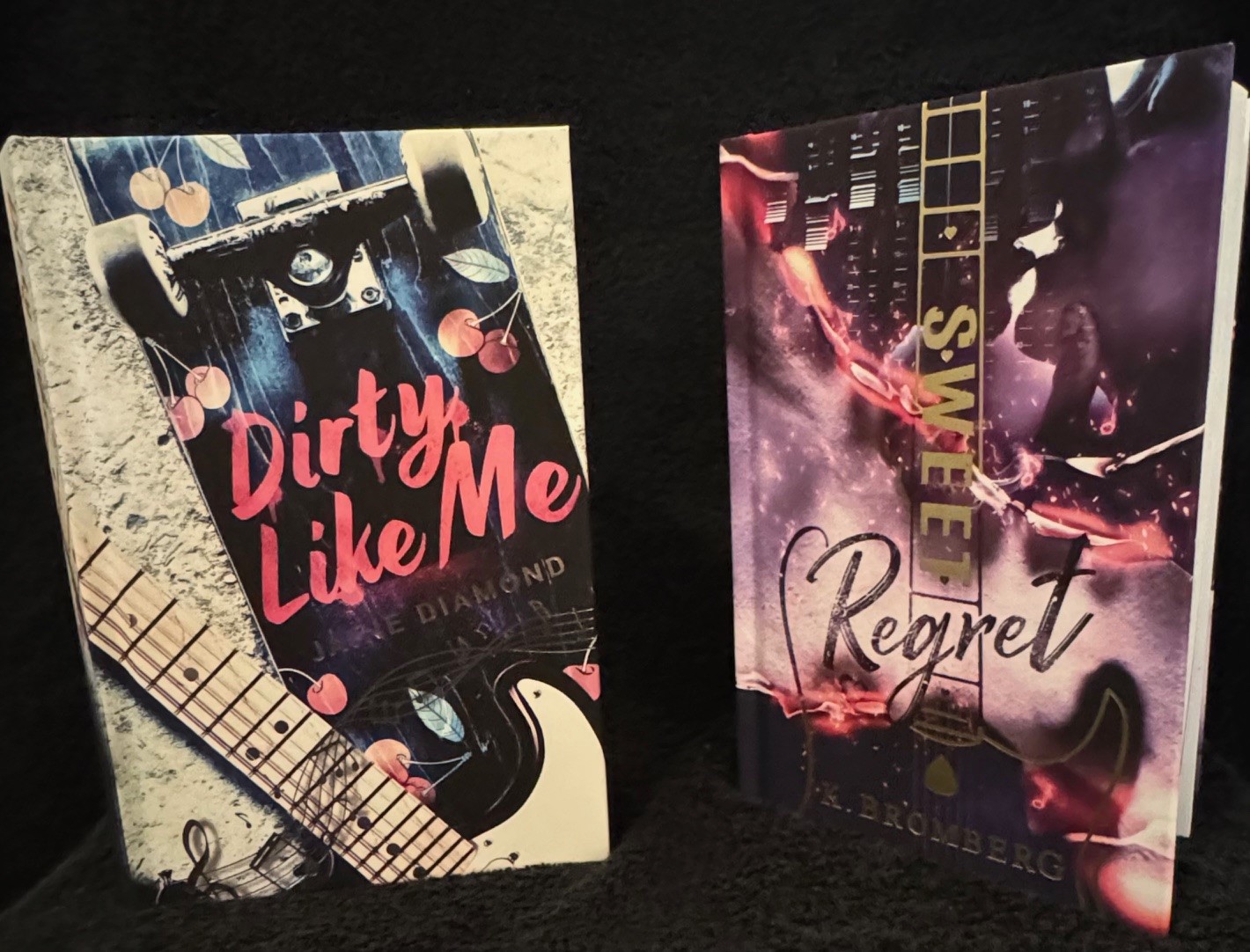 Two printed hardcover novels with foil stamped details