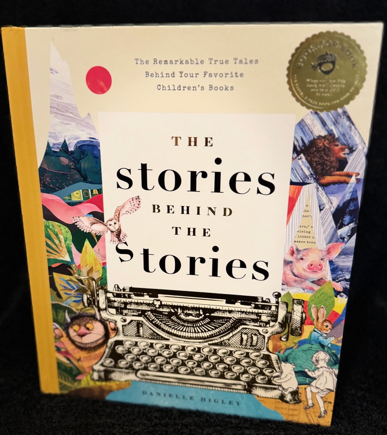 Illustrated collage hardcover with a gold foil seal